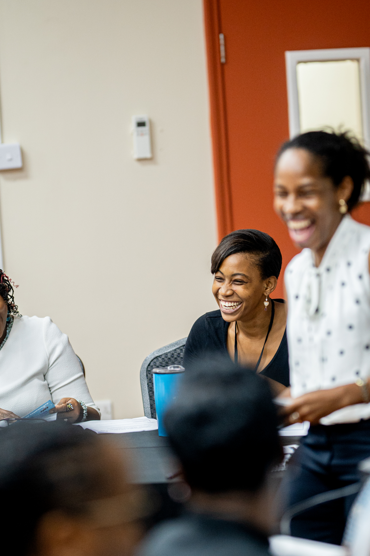 Unlock Your Potential attendees laughing together